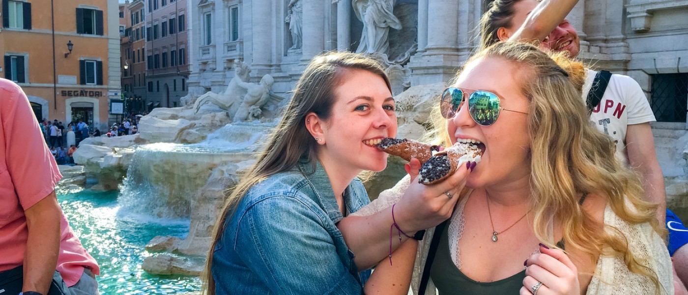 UNE Students eating a cannoli in Italy