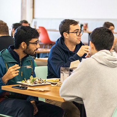 U N E students eating in the dining hall in the Danielle Ripich Commons on the Biddeford Campus