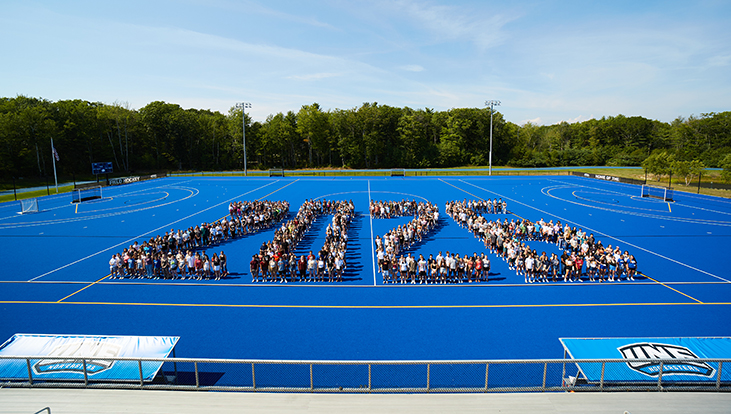 The Class of 2026 poses for a photo in an arranged pattern depicting the year "2026"