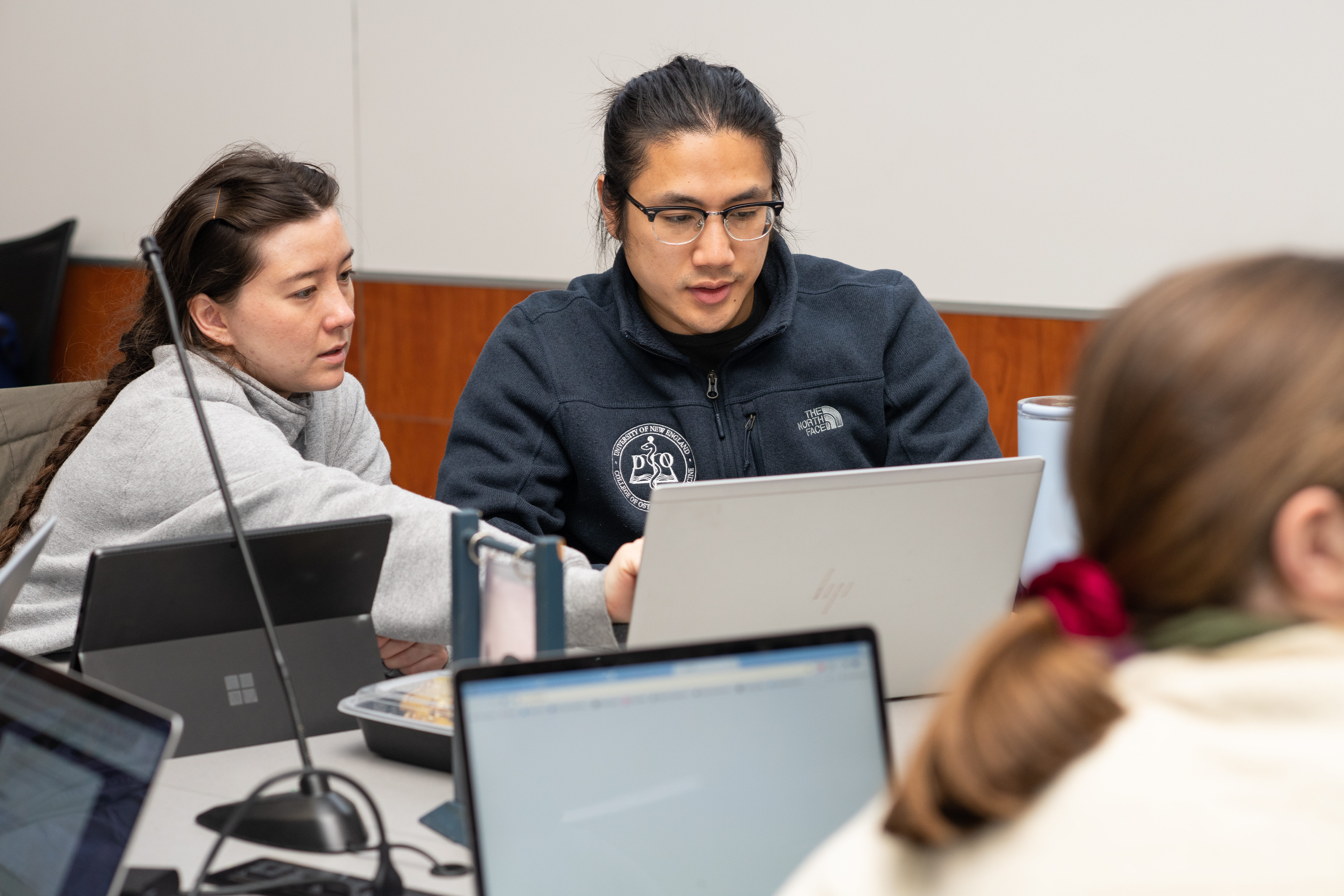 UNE COM students study in groups in Leonard Hall