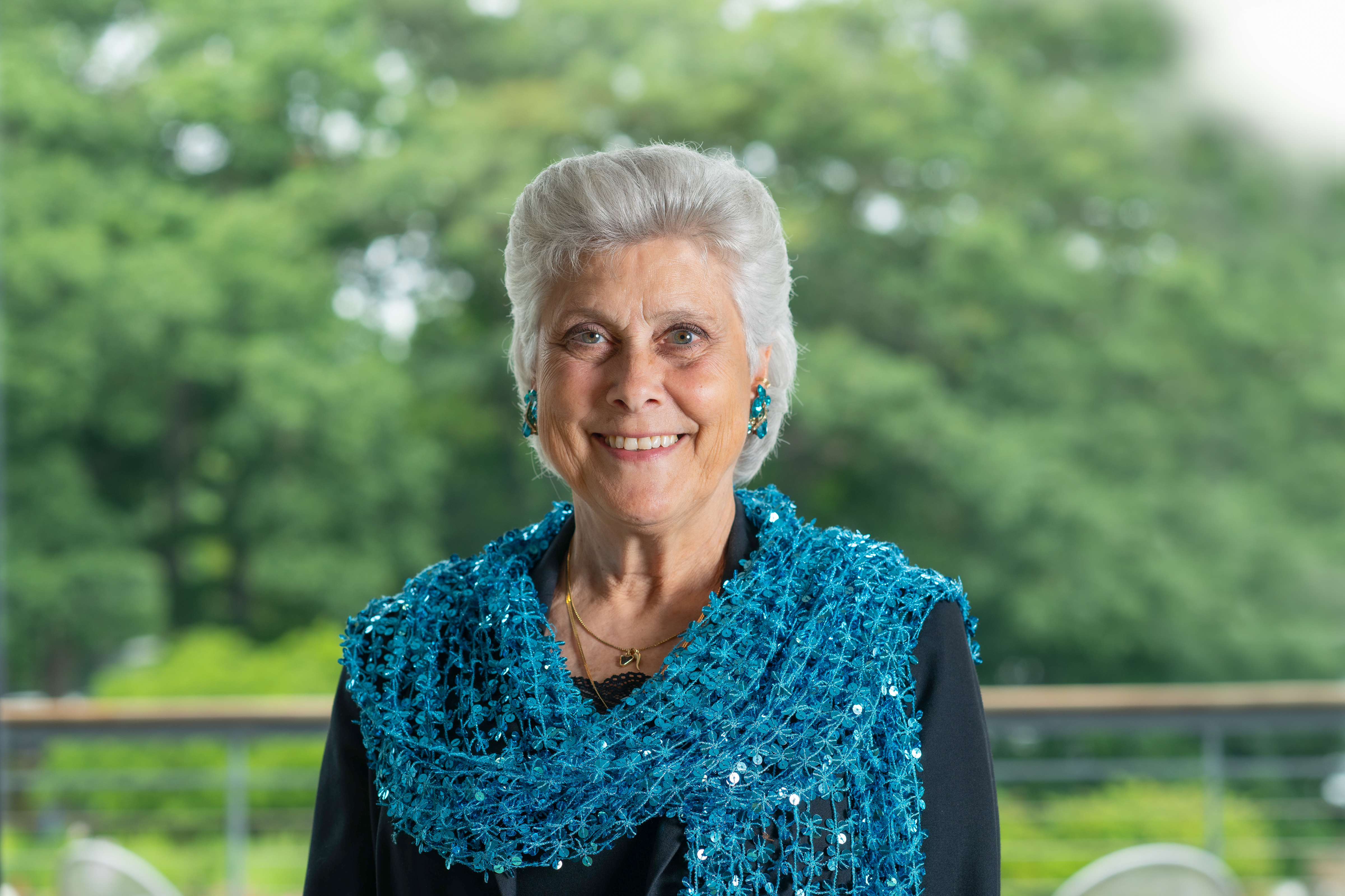 Portrait of Marilyn Gugliucci against trees on the Biddeford Campus