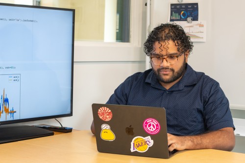 A student studies on their laptop