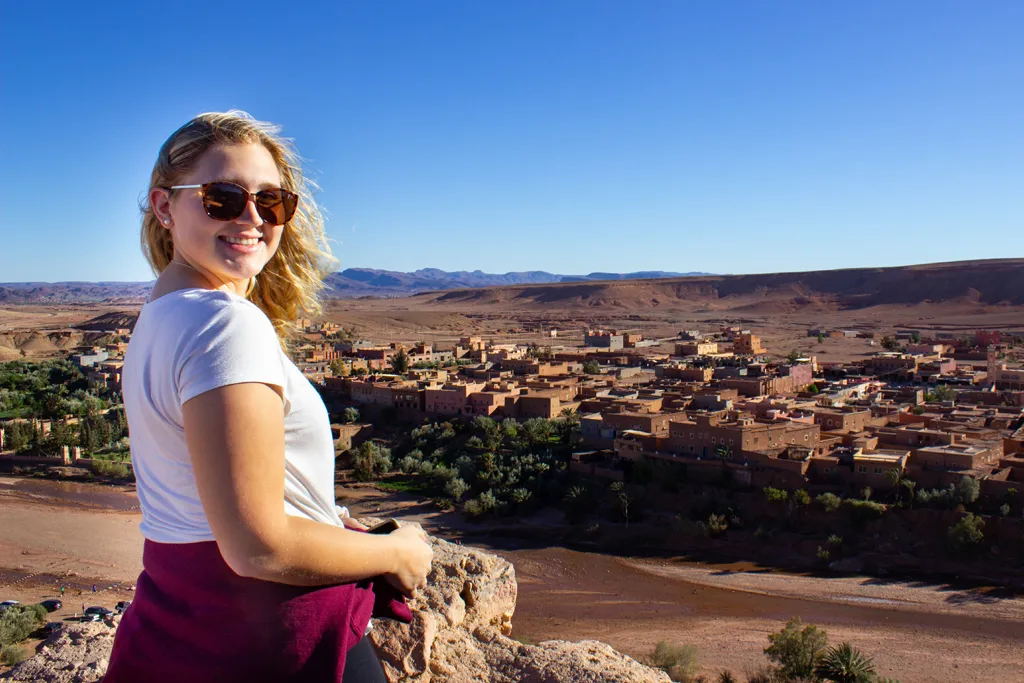 a female student overlooks a village