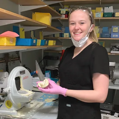 Biological Sciences major Emily Morris interns as a dental assistant