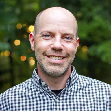 Headshot of U N E employee Bob Kennedy