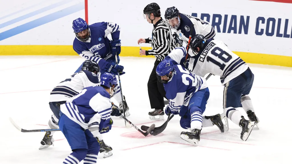 The two teams scramble for the puck.