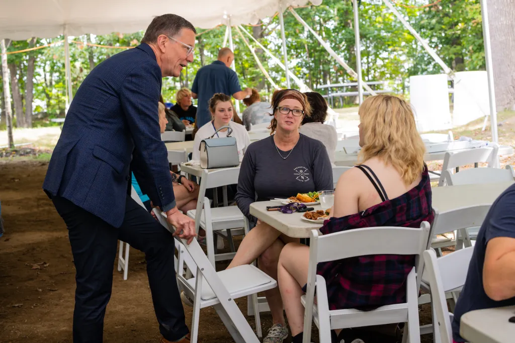 President with parents and students