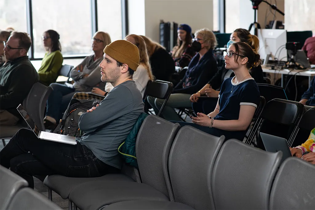 U N E students sitting at a climate lecture