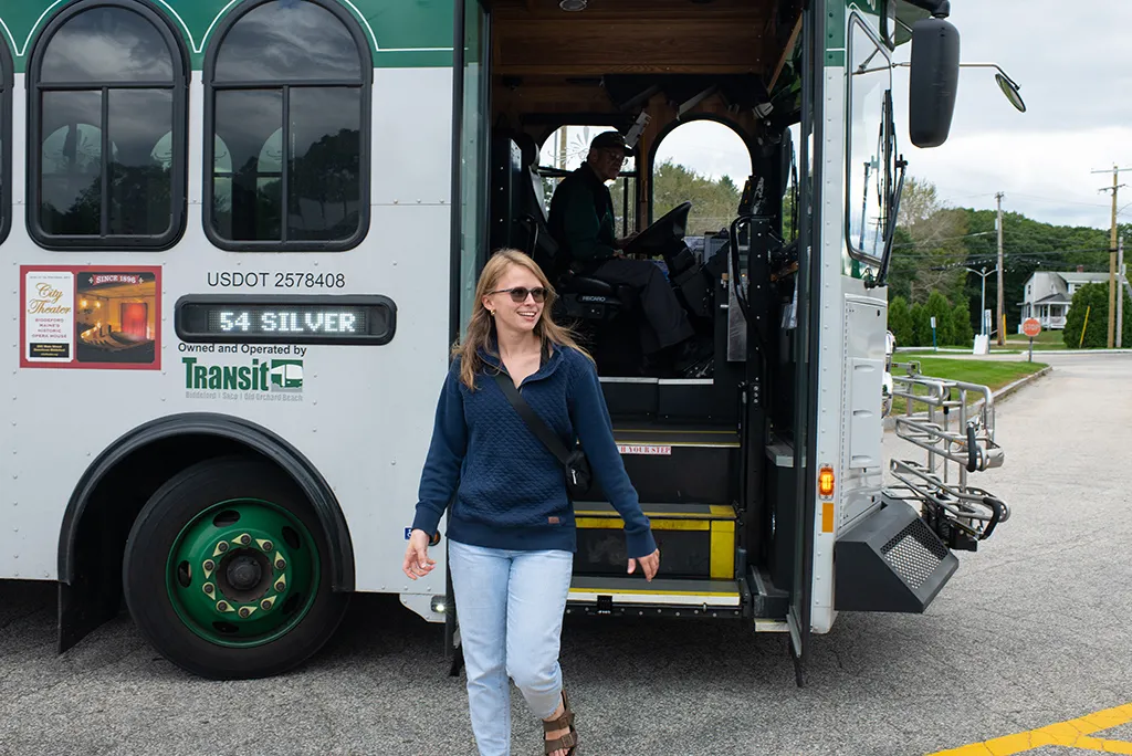 A student getting off the Biddeford bus