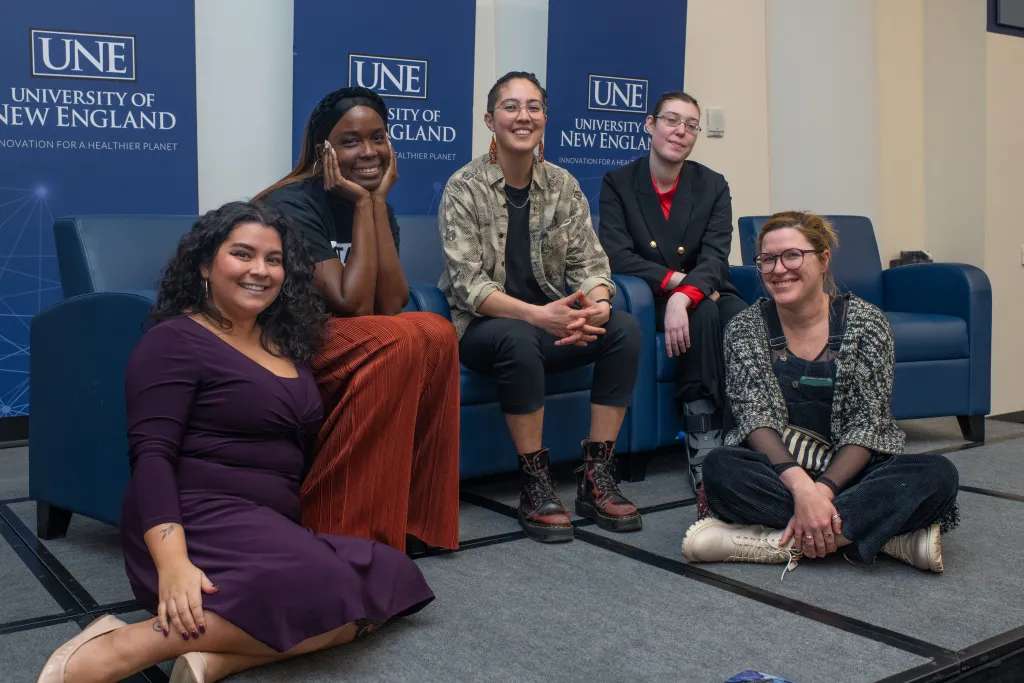 The panelists pose with UNE Director of Intercultural Student Engagement Andrea Peredes