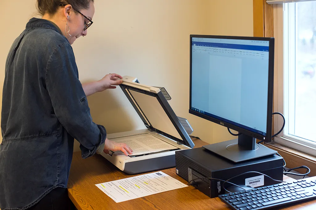 A student upload files to a computer via a scanner