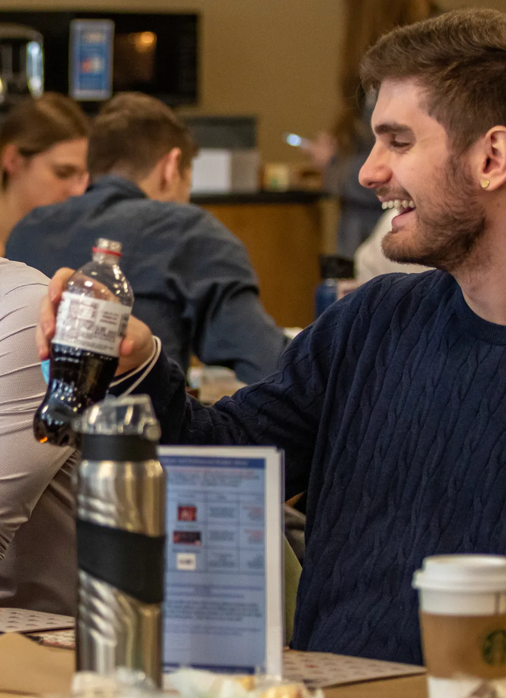 A student hold a soda during a lunch break in the Nor'easter Cafe