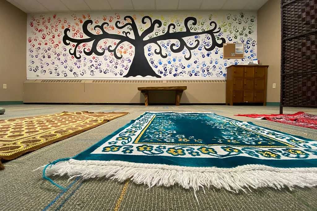 Interior shot of the Interfaith Prayer and Reflection Room featuring rugs