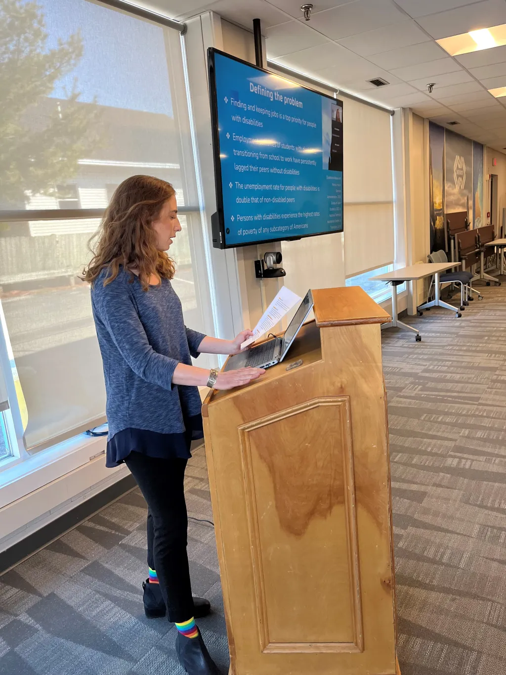 LEND student standing at podium