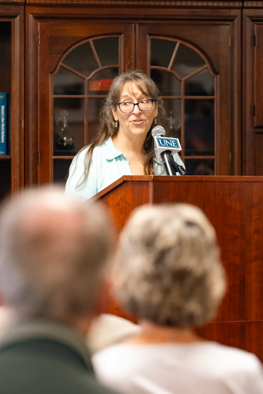 Jennifer Tuttle speaks to the crowd from the podium