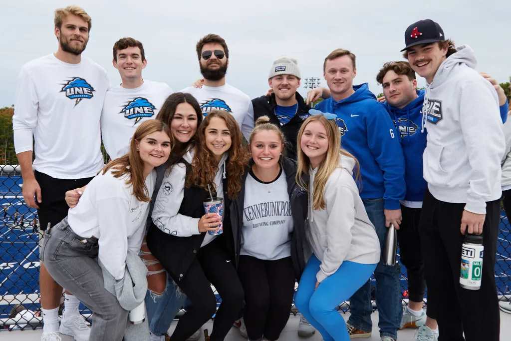 A group of U N E students posing together