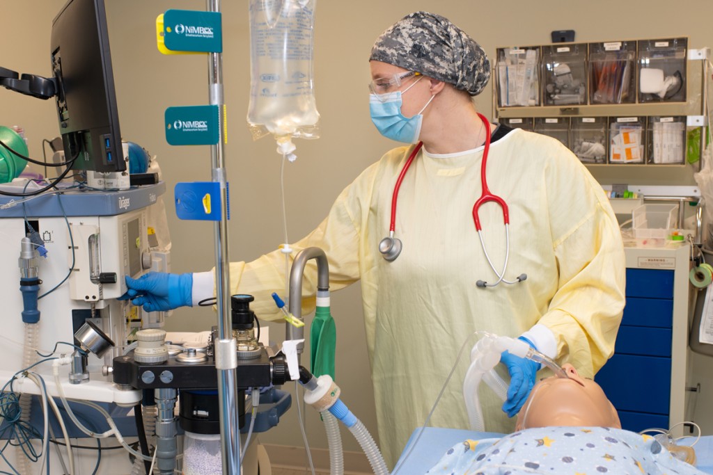 A U N E student practices giving a patient simulator anesthesia