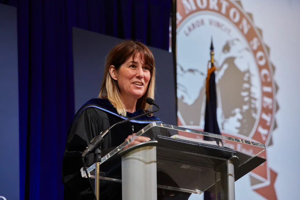 Alicia Fereday, MBA, vice president for Institutional Advancement, speaks at the podium