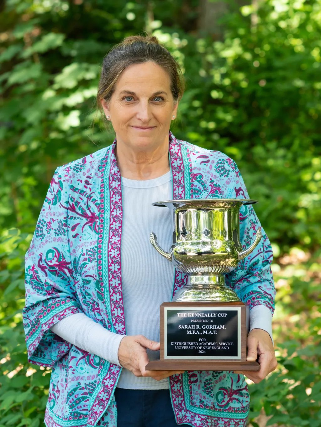 Sarah Gorham poses holding the Kenneally Cup trophy