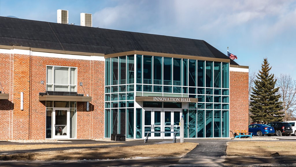 Close-up of a brick building with large glass windows