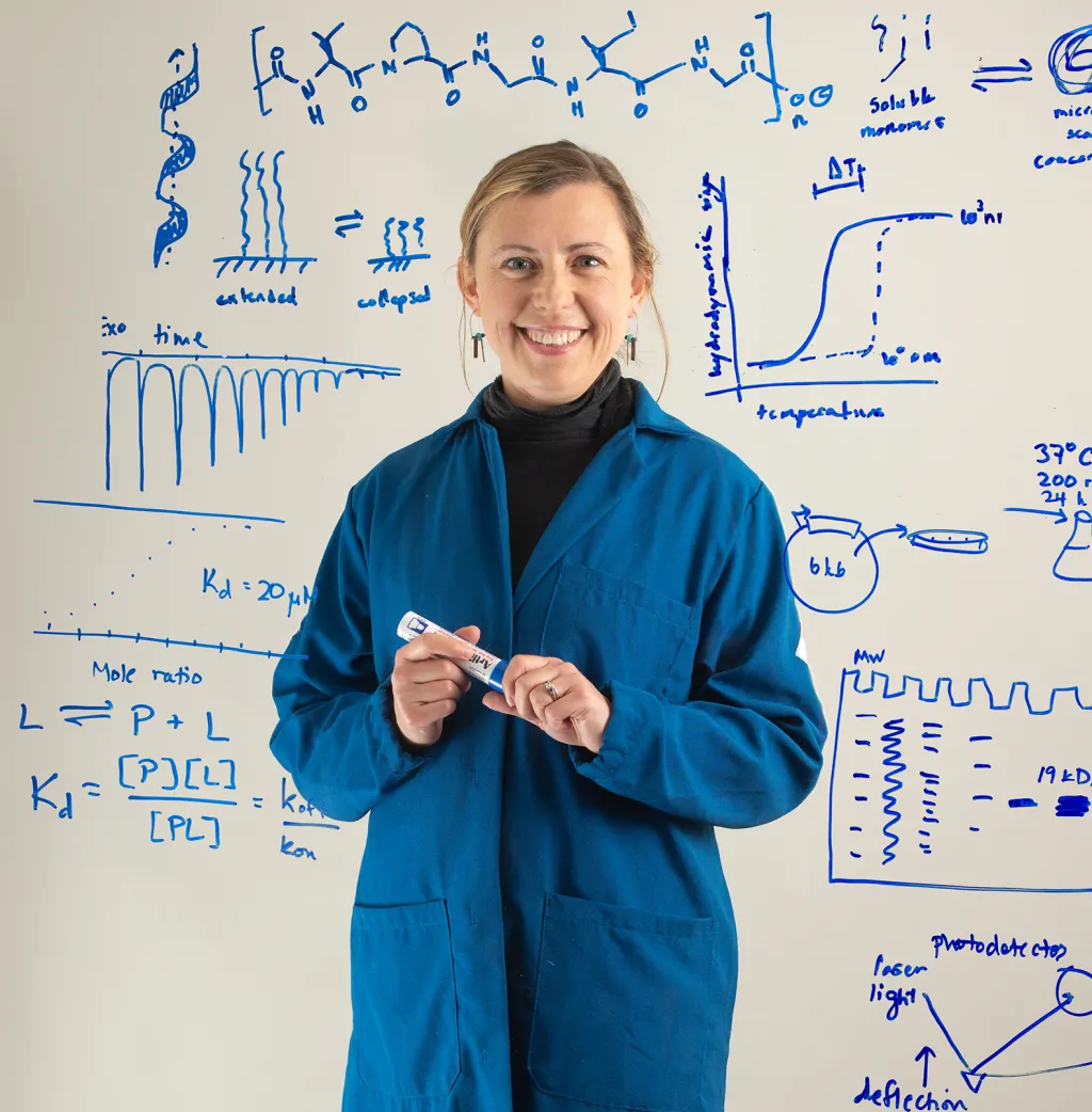 Eva Rose Balog, Ph.D., surrounded by examples of her research