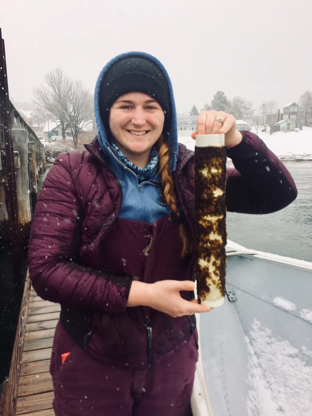 UNE Marine Technician Liz Johndrow holds a spool of Sugar kelp seedlings from the UNE seaweed nursery.