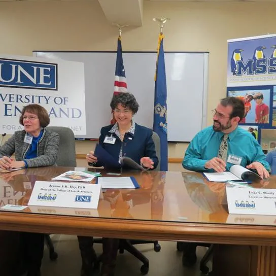 Associate Dean Susan Gray, Ed.D., Dean Jeanne Hey, Ph.D., and Luke C. Shorty, executive director of MSSM, prepare to sign 