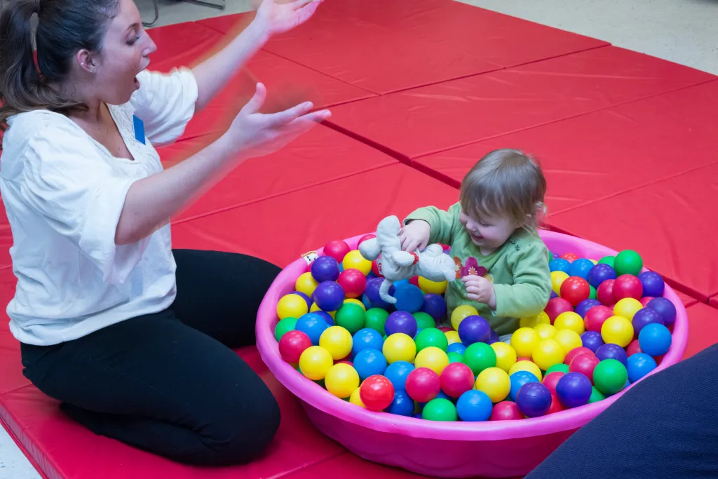 As the weeks go on, the toddlers become more comfortable playing while their parents join a support group in the next room