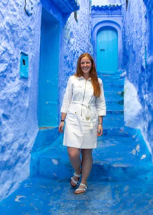 A study abroad student walking through the Blue City in Morocco