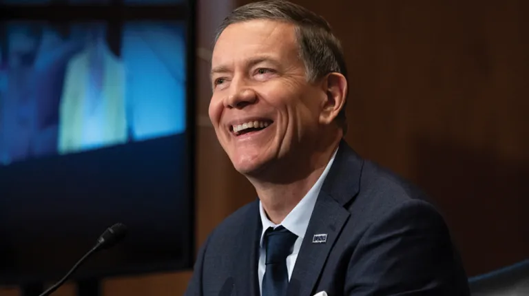 U N E President James Herbert testifies at a senate hearing