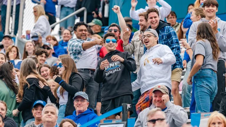 Fans cheer on the team