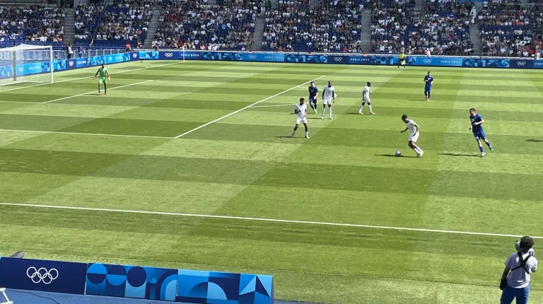 Norm O'Reilly captures a photo of a mens' soccer game at the 2024 Summer Games in Paris.