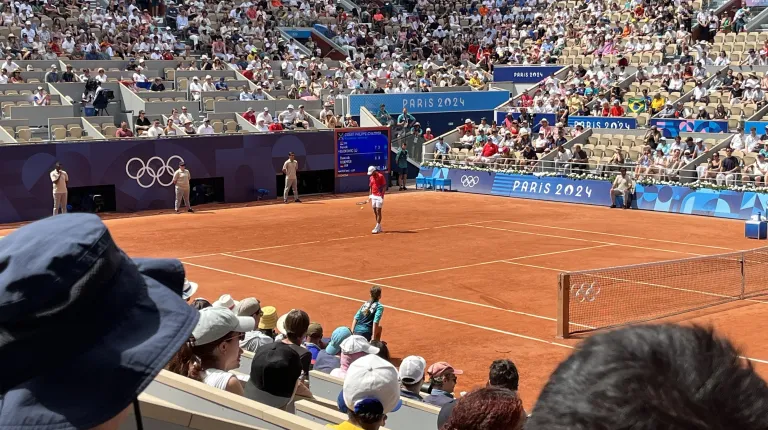 Olympic athletes play tennis in the stadium