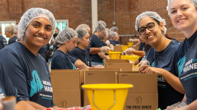 Students pose for a photo at the 2024 Meals for Maine event