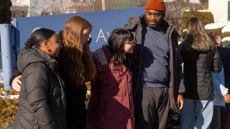 UNE students pose for a photo outside Ocean Avenue Elementary School