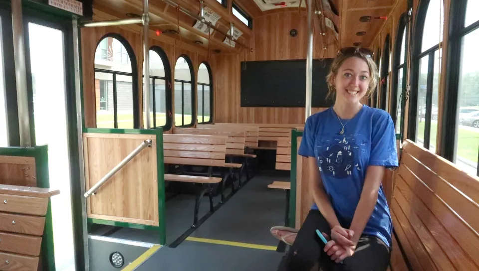 a U N E student rides the trolley