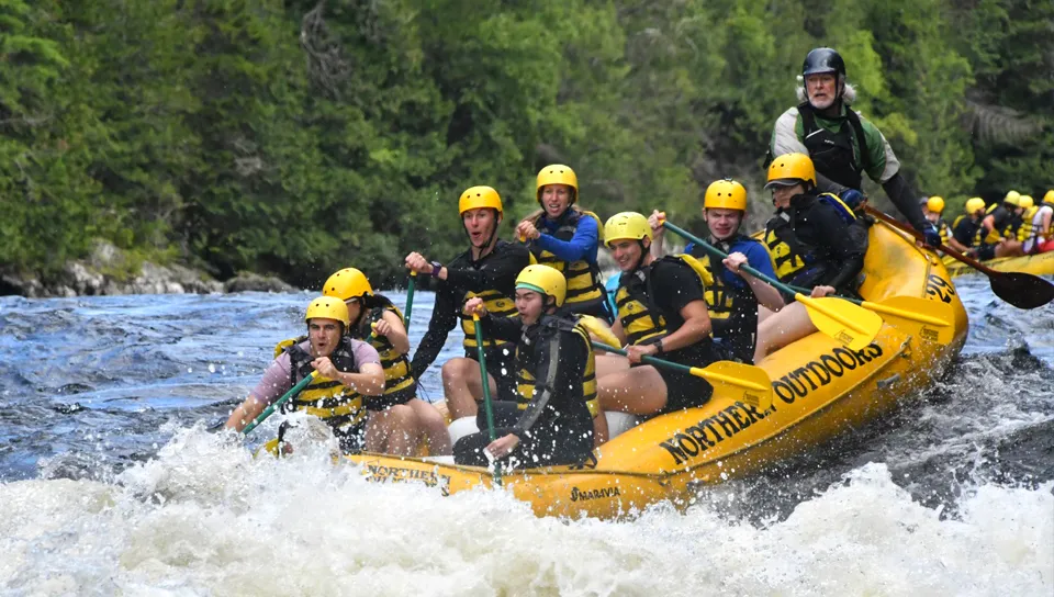 Graduate students white water rafting