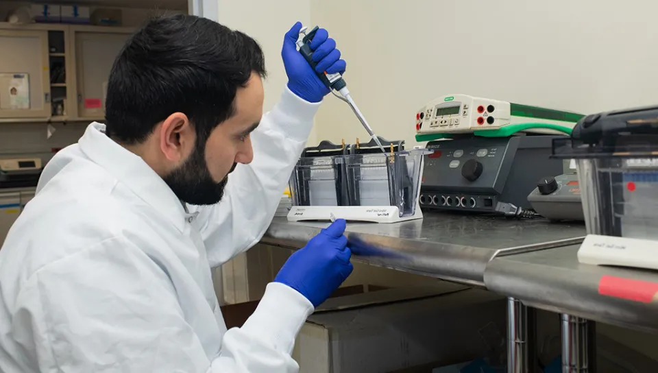 A student using lab tools for research