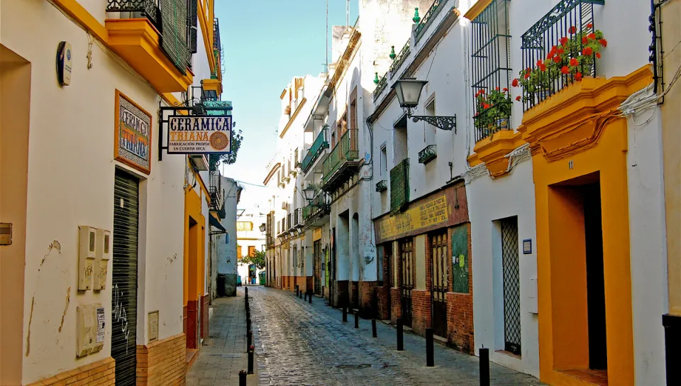 A street view with white and yellow buildings