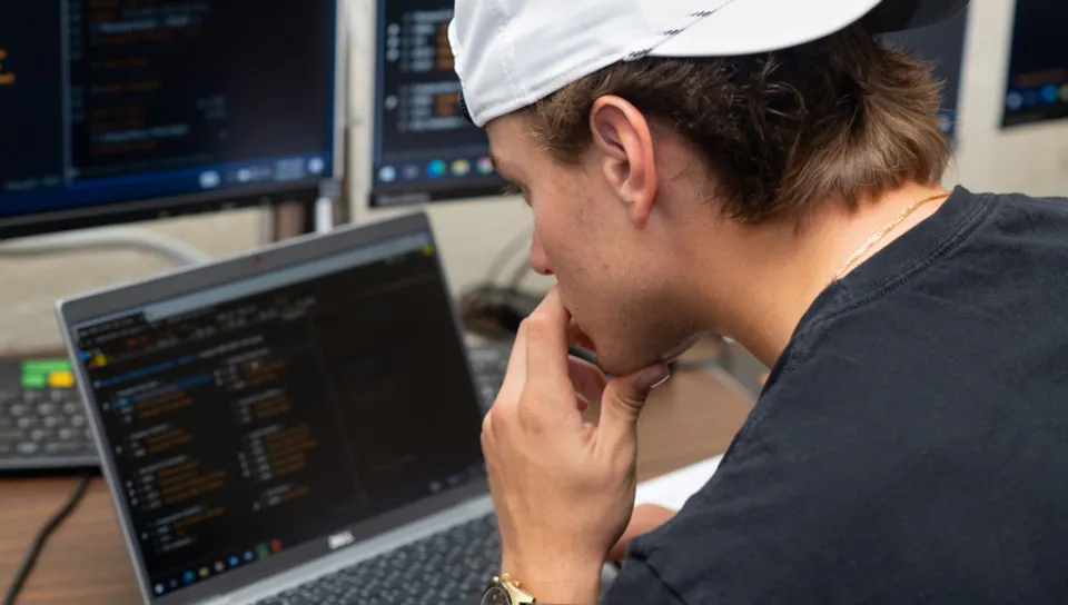 A student works with data on a laptop