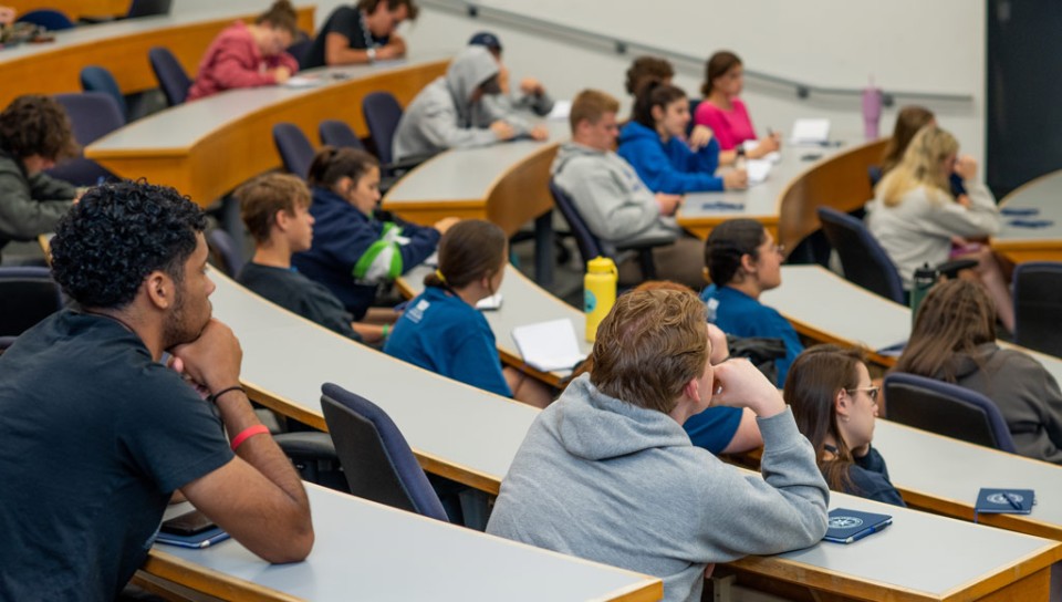 Students sitting in a lecture hall during an information session