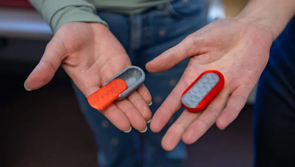 Students display 3D-printed medication containers