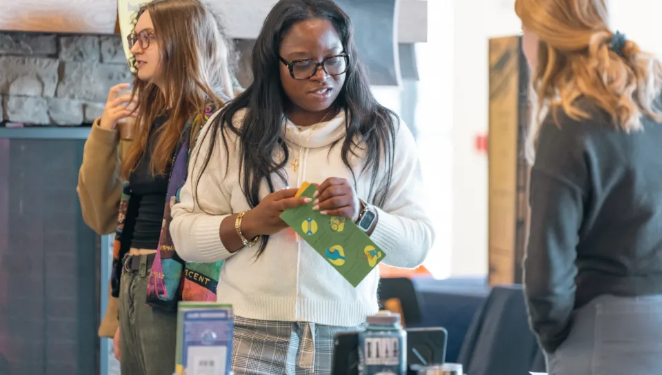 Students mingle at an organization fair in the Danielle N. Ripich Commons