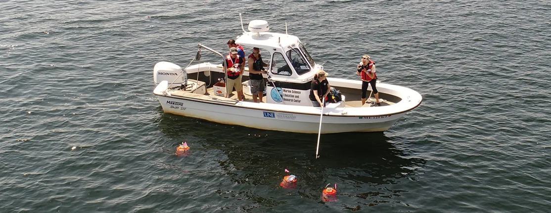 Students on a U N E research boat