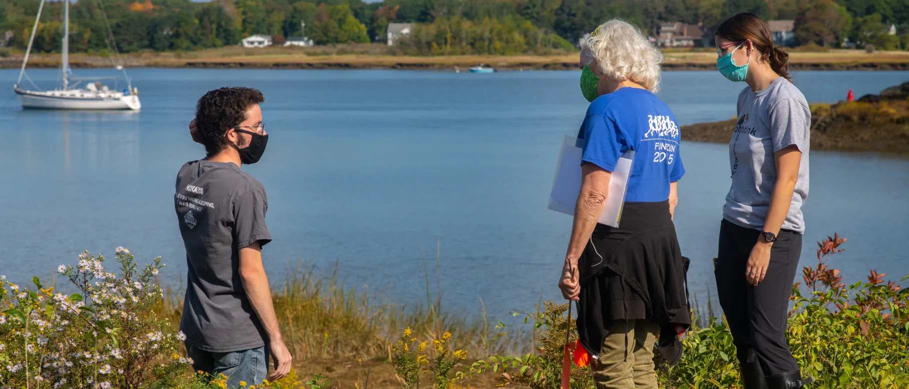 Pam Morgan, center, and students on the shoreline in Biddeford.