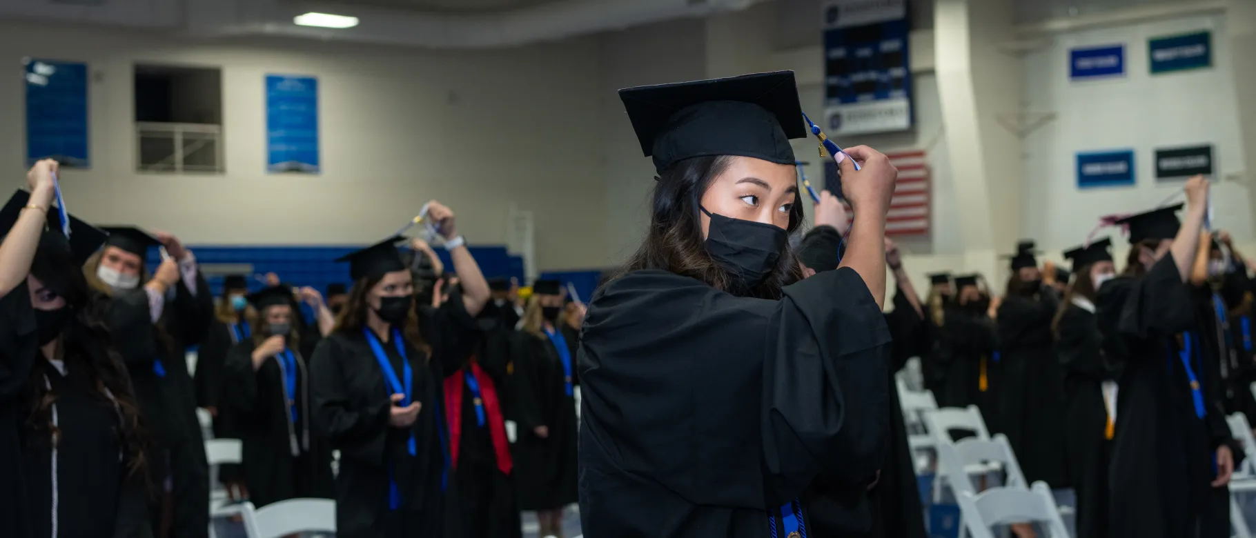 A student turns her tassel as she graduates from the Westbrook College of Health Professions