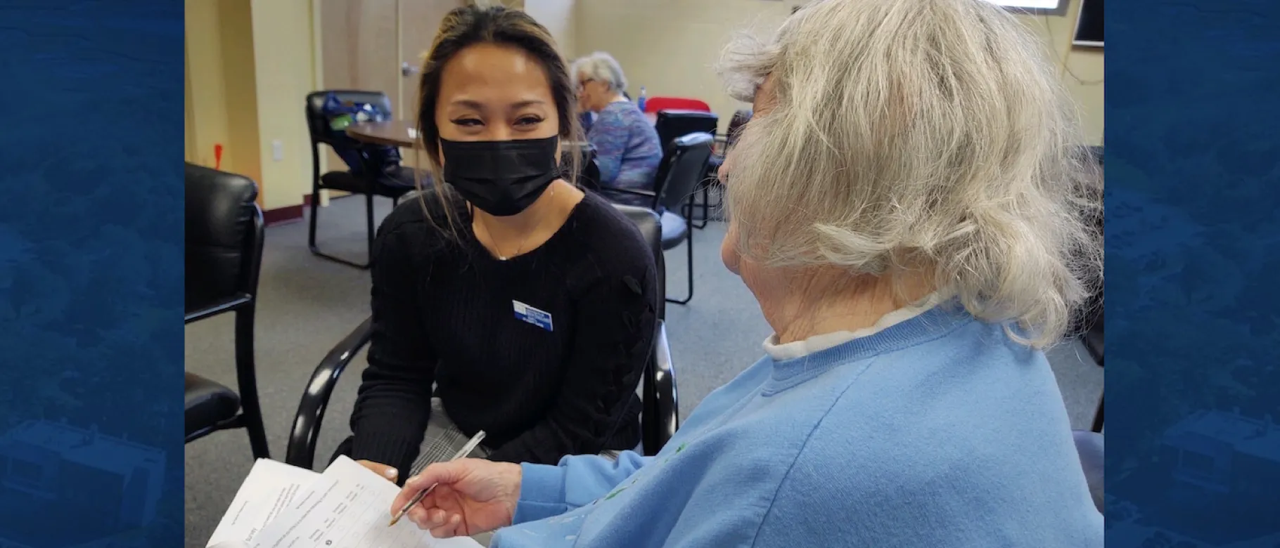 Suki Liang assists a respondent filling out the survey at the Salvation Army in Portland