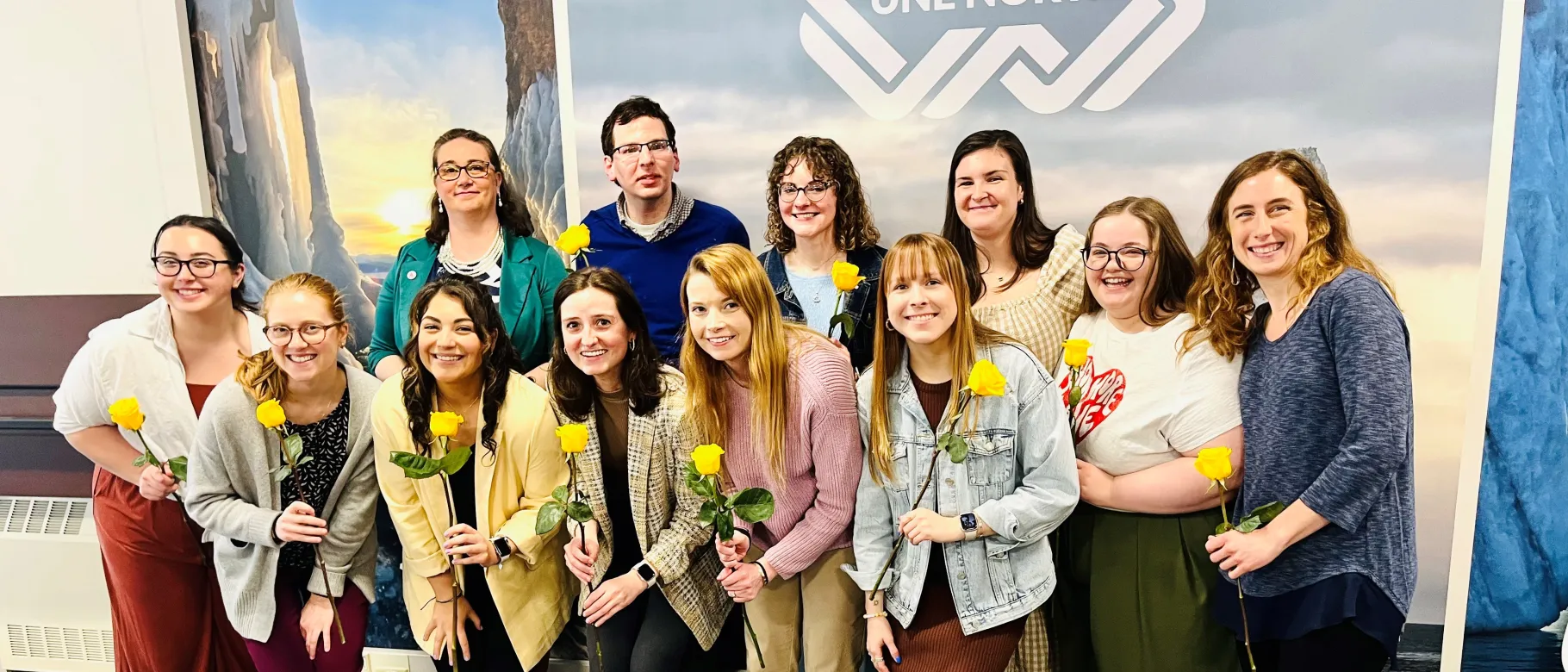 LEND trainees smiling with flowers