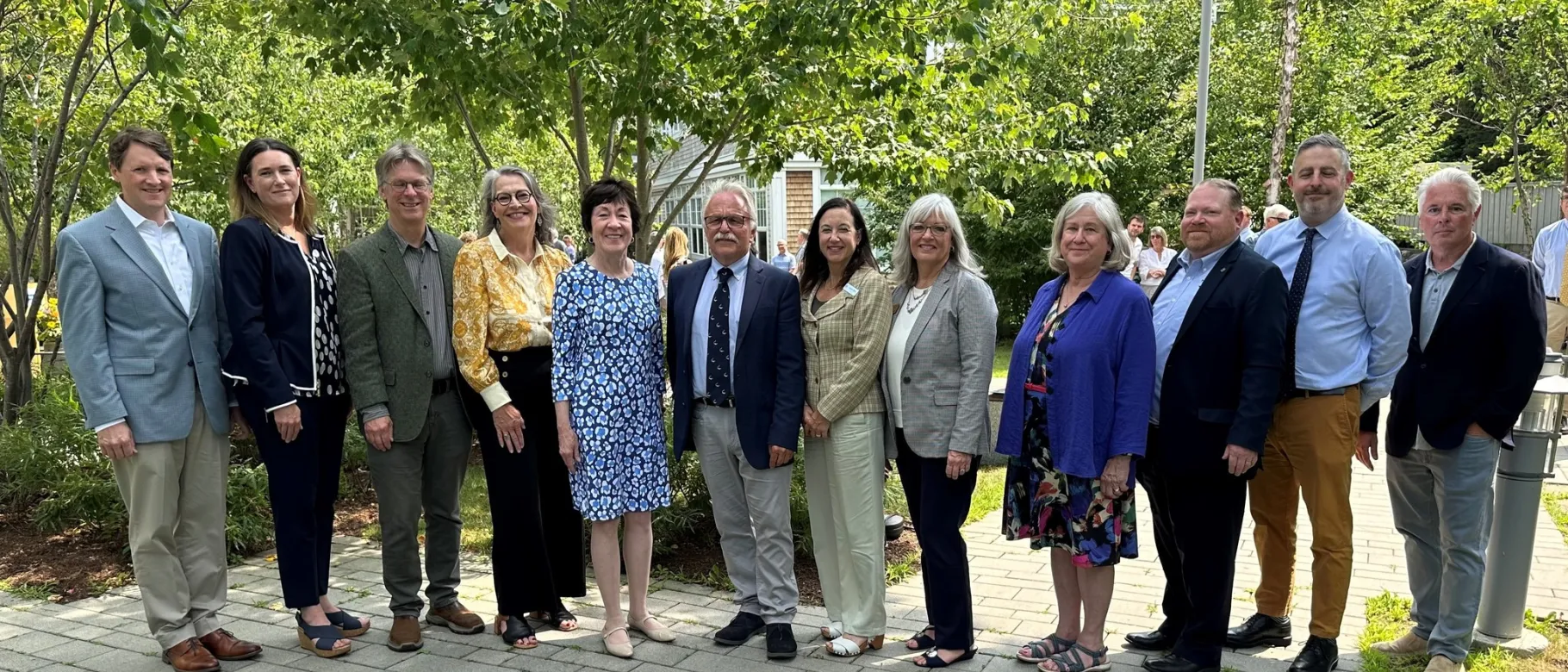 A group of Maine biomedical researchers poses with Sen. Susan Collins