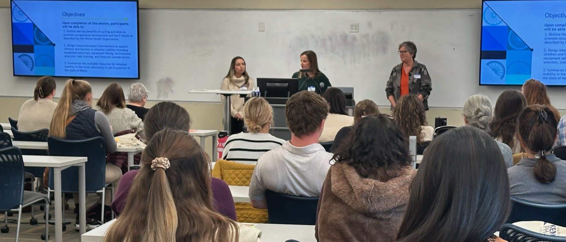 Three UNE occupational therapists give a classroom presentation